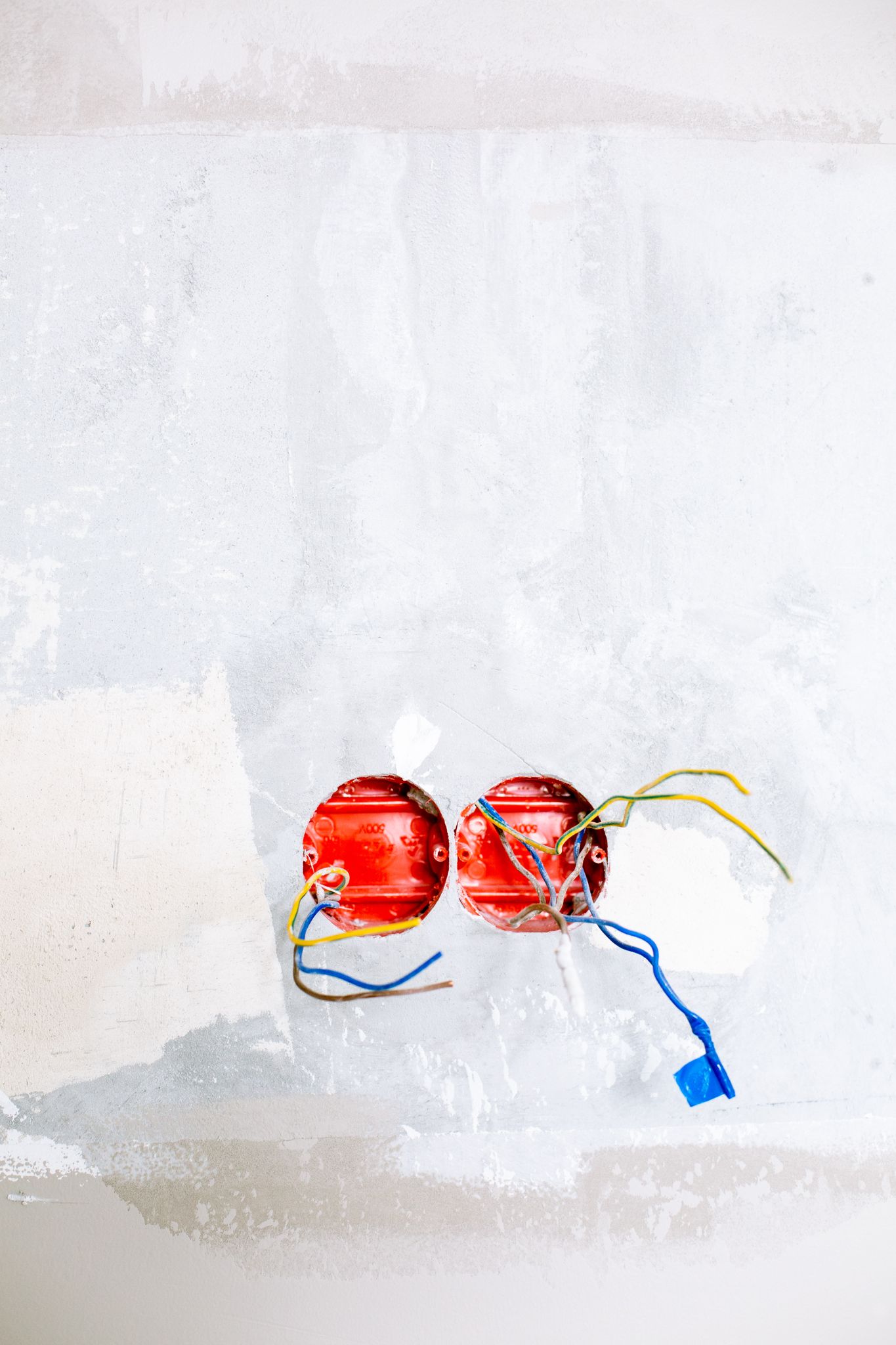 Close-up of electrical wiring and sockets in a home renovation project.